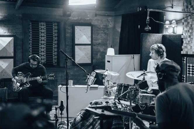 A full band recording a live session.